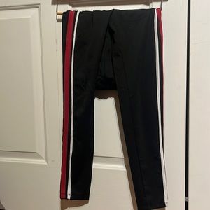 Black pants with red and white stripes